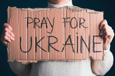 Pray for Ukraine concept background. Concept symbol of help support and no war in the country of Ukraine.の写真素材