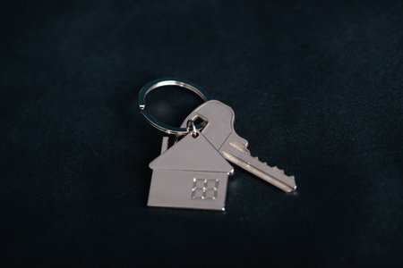Keychain house with keys. Realtor, mortgage, your house, home loan concept. Copy spaceの写真素材