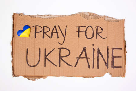 Pray for Ukraine concept background. Concept symbol of help support and no war in the country of...