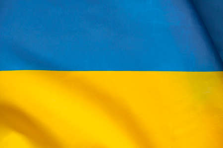 Flag of Ukraine, UA. Blue and yellow colors. Close up shot, background