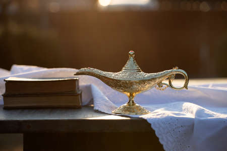 Ramadan Kareem festive greeting card for Muslim holy month with Aladdin lamp of wishes and Quranの写真素材