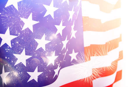 Celebrating Independence Day. United States of America USA flag with fireworks background for 4th of...