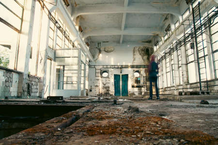Person standing with hope on ruins of destroyed during war fighting home house