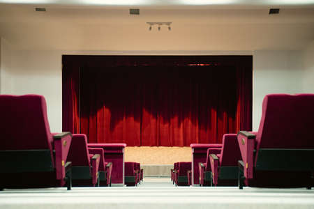 Theater curtain and stage with dramatic lightingの写真素材