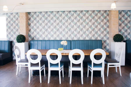 Empty hall of a cozy, modern restaurant.