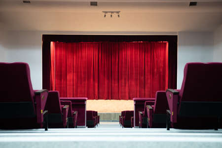 Theater curtain and stage with dramatic lighting