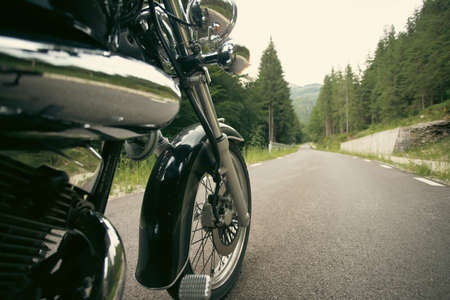 Motorcycle detail closeup front fork and wheel. Travel and sport, speed and freedom concept
