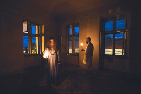 Ghosts in abandoned, haunted house. Horror scene of scary spirits, halloween concept.の写真素材