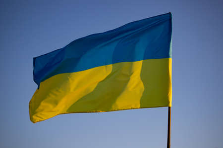 Detail of the national flag of Ukraine waving in the wind on a clear day. Democracy and politics.の写真素材