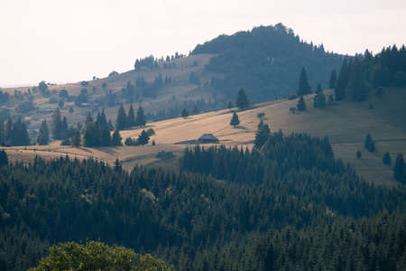 Magic summer sunset over the mountain village at Tihuta, Piatra Fantanele, Bistrita, Romaniaの写真素材