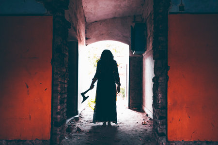 Ghost in abandoned, haunted house. Horror scene of spooky silhouette holding old axe, halloween...