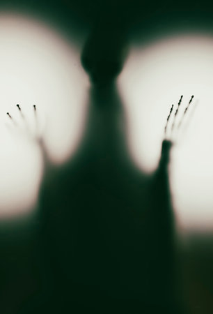 Horror skeleton or grim reaper behind the matte glass. Halloween festival concept.Blurred pictureの写真素材