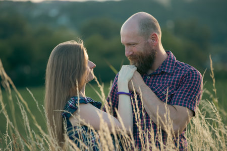Loving young couple hugging and smiling together on nature background.の写真素材
