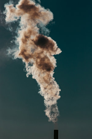 Air pollution from power plant chimneys. Industry and global warming conceptの写真素材