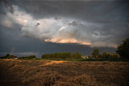 Dramatic sky before storm over summer farmlandの写真素材