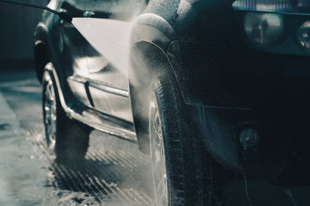 Car wash with pressurized water in car wash outside.の写真素材