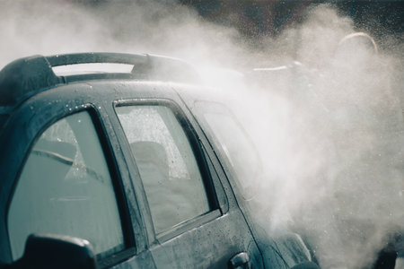 Car wash with pressurized water in car wash outside.の写真素材