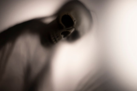 Horror skeleton or grim reaper behind the matte glass. Halloween festival concept.Blurred pictureの写真素材