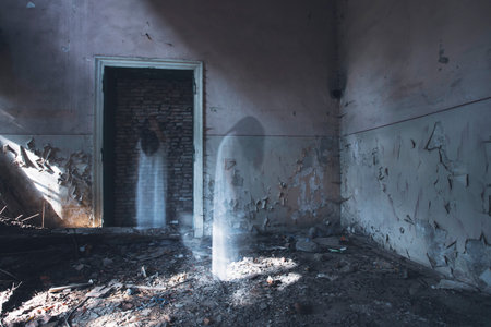 Ghost in abandoned, haunted house. Horror scene of scary spirit of a woman, halloween concept.の写真素材