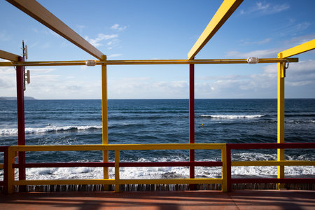 Cozy terrace on the beach, idyllic view of the seashore. Tropical summer vacation concept.の写真素材