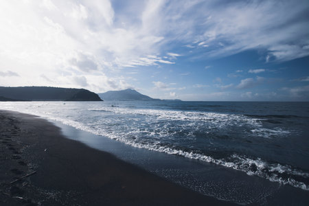 View of Ciraccio beach with black sand and clear water, Procida, Italyの写真素材