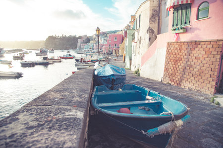 View of the Port of Corricella with lots of colorful houses on a sunny day in Procida Island, Italy.の写真素材