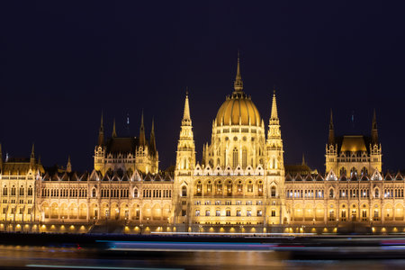Night view of the illuminated building of the hungarian parliament in Budapestの写真素材