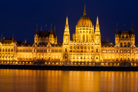 Night view of the illuminated building of the hungarian parliament in Budapestの写真素材