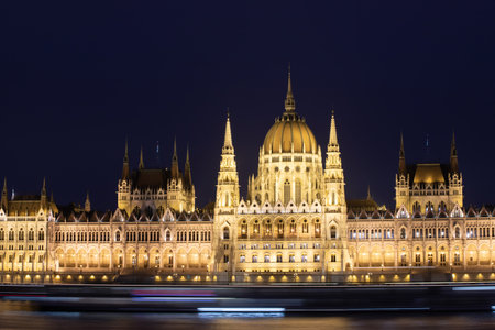 Night view of the illuminated building of the hungarian parliament in Budapestの写真素材
