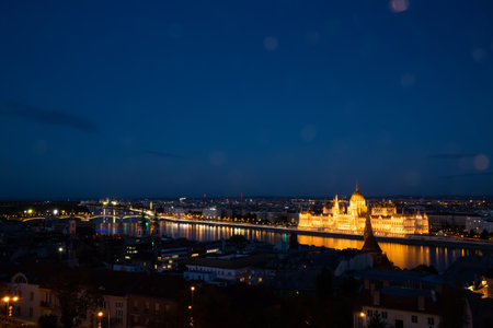 Night view of the illuminated building of the hungarian parliament in Budapestの写真素材