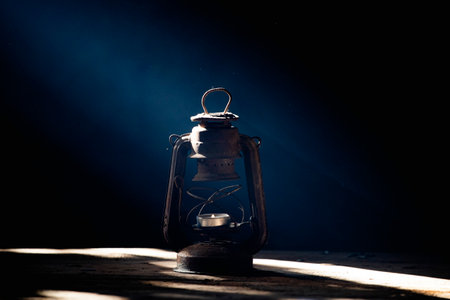Vintage lamp glowing in smoky fantasy night. Halloween backgroundの写真素材