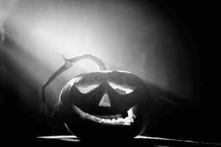 Jack O' Lantern glowing in smoky fantasy night. Halloween backgroundの写真素材