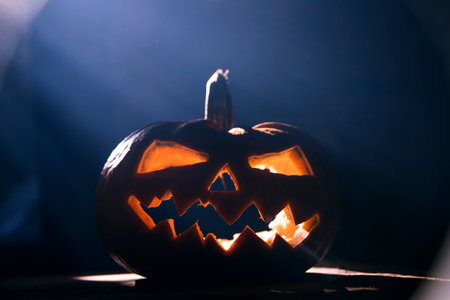 Jack O' Lantern glowing in smoky fantasy night. Halloween backgroundの写真素材