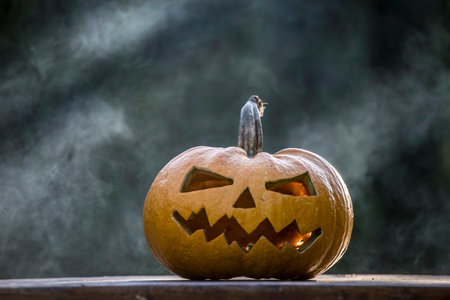 Jack O' Lantern glowing in smoky fantasy night. Halloween backgroundの写真素材