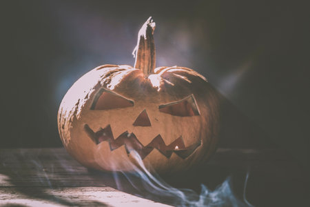 Jack O' Lantern glowing in smoky fantasy night. Halloween backgroundの写真素材