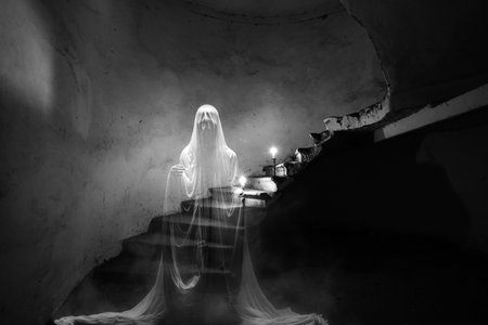 Abandoned haunted manor with flying ghosts. Dark dirty grunge and creepy atmosphereの写真素材