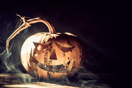Jack O' Lantern glowing in smoky fantasy night. Halloween backgroundの写真素材