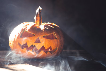 Jack O' Lantern glowing in smoky fantasy night. Halloween backgroundの写真素材