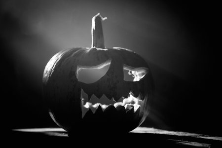 Jack O' Lantern glowing in smoky fantasy night. Halloween backgroundの写真素材