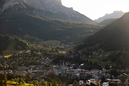 Town of Cortina d' Ampezzo in green landscape of Dolomites Alps, Veneto region of Italyの写真素材