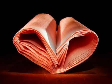 Heart made of pink napkinsの写真素材