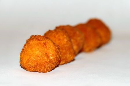 fried potato balls on white backgroundの写真素材