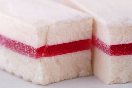 two pieces of pastila with red marmalade insideの写真素材