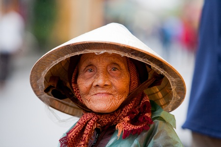 HOI AN, VIETNAM - DECEMBER 20, 2011: Unidentified Vietnamese old woman in Hoi An, december 20, 2011 in Vietnam. のeditorial素材