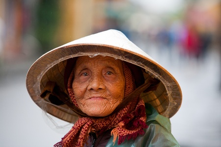 HOI AN, VIETNAM - DECEMBER 20, 2011: Unidentified Vietnamese old woman in Hoi An, december 20, 2011 in Vietnam. のeditorial素材