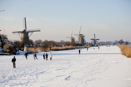KINDERDIJK - FEBRUARY 4, 2012: Start of the skating period in the Netherlands at the Dutch historic windmills in Kinderdijk, february 4, 2012 in the Netherlandsのeditorial素材