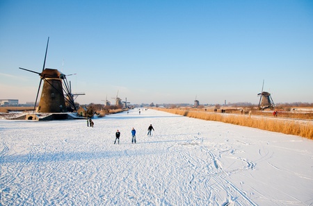 KINDERDIJK - FEBRUARY 4, 2012: Start of the skating period in the Netherlands at the Dutch historic windmills in Kinderdijk, february 4, 2012 in the Netherlandsのeditorial素材