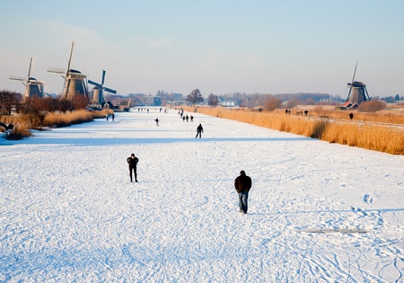 KINDERDIJK - FEBRUARY 4, 2012: Start of the skating period in the Netherlands at the Dutch historic windmills in Kinderdijk, february 4, 2012 in the Nethelandsのeditorial素材