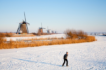 KINDERDIJK - FEBRUARY 4, 2012: Start of the skating period in the Netherlands at the Dutch historic windmills in Kinderdijk, february 4, 2012 in the Netherlandsのeditorial素材