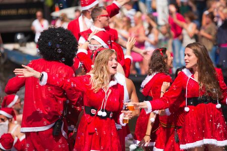AMSTERDAM, THE NETHERLANDS - AUGUST 4, 2012: Dutch actress and tv-host Sophie Hillbrand and other participants dance in front of spectators at the famous Canal Parade of the Amsterdam Gay Pride 2012 on August 4, 2012 in Amsterdamのeditorial素材